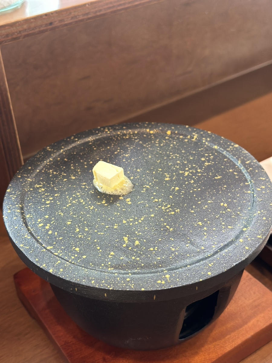 Melting butter on the grill at Misyuldang Ulsan