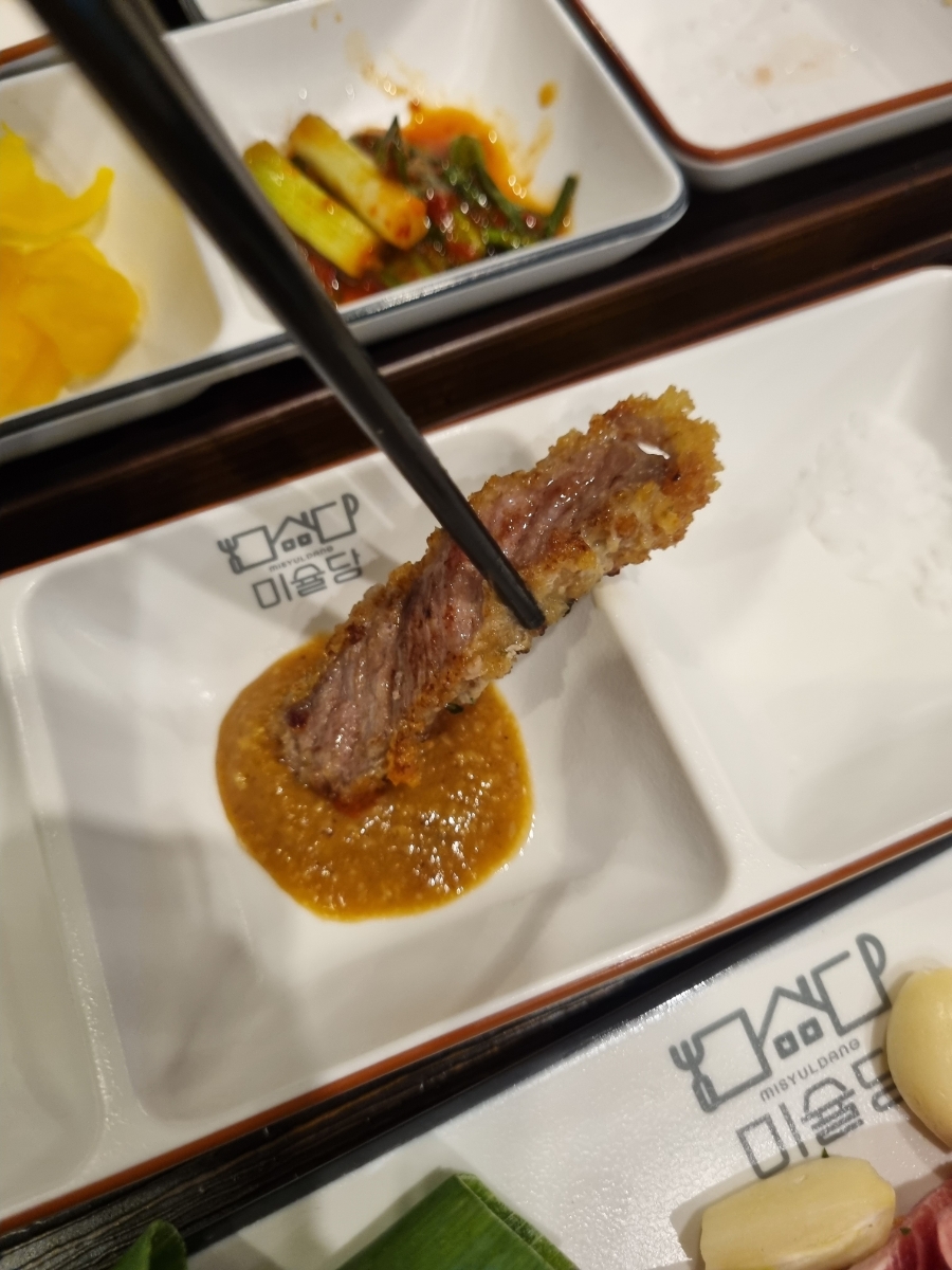 Dipping gyukatsu in miso sauce at Misyuldang Ulsan