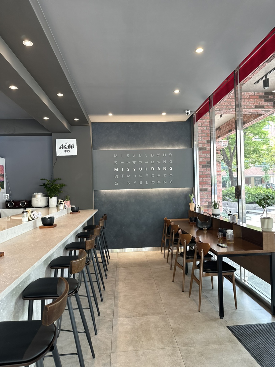 Modern interior of Misyuldang Ulsan with bar seating