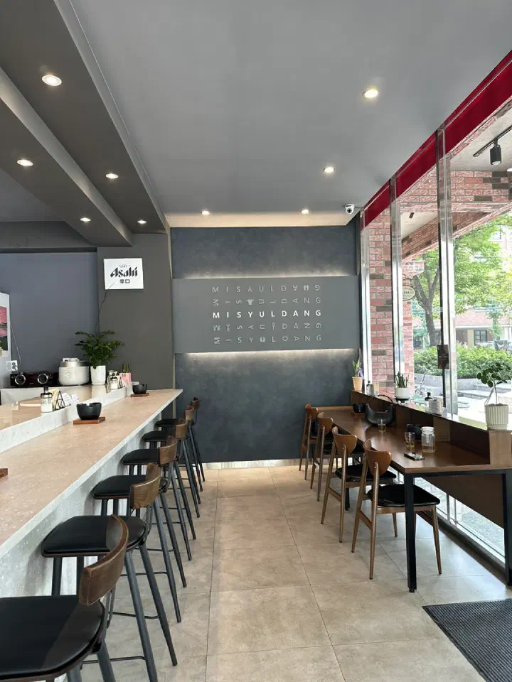 Modern interior of Misyuldang Ulsan with bar seating
