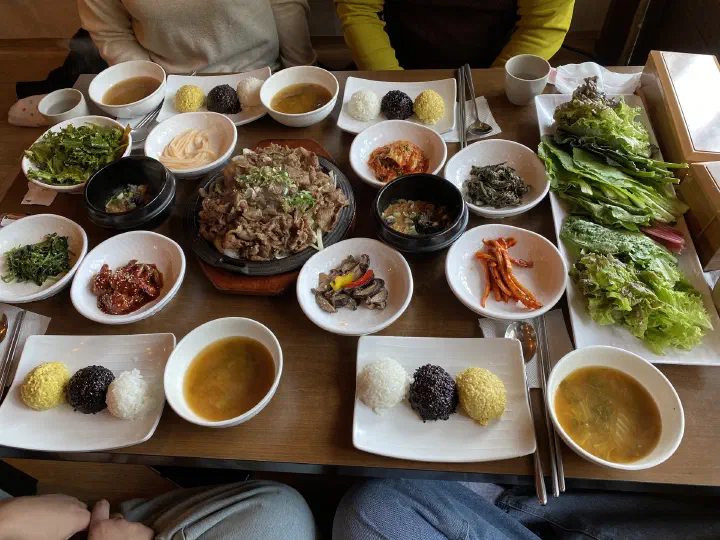 Full ssambap set for two at Mokhyangwon with lettuce wraps, tricolor rice, soybean paste soup, and eight side dishes