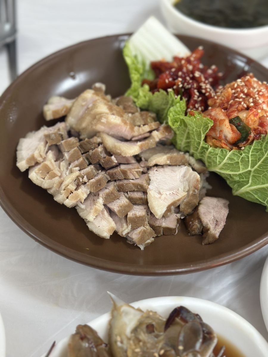 Bossam Korean boiled pork belly with kimchi and cabbage
