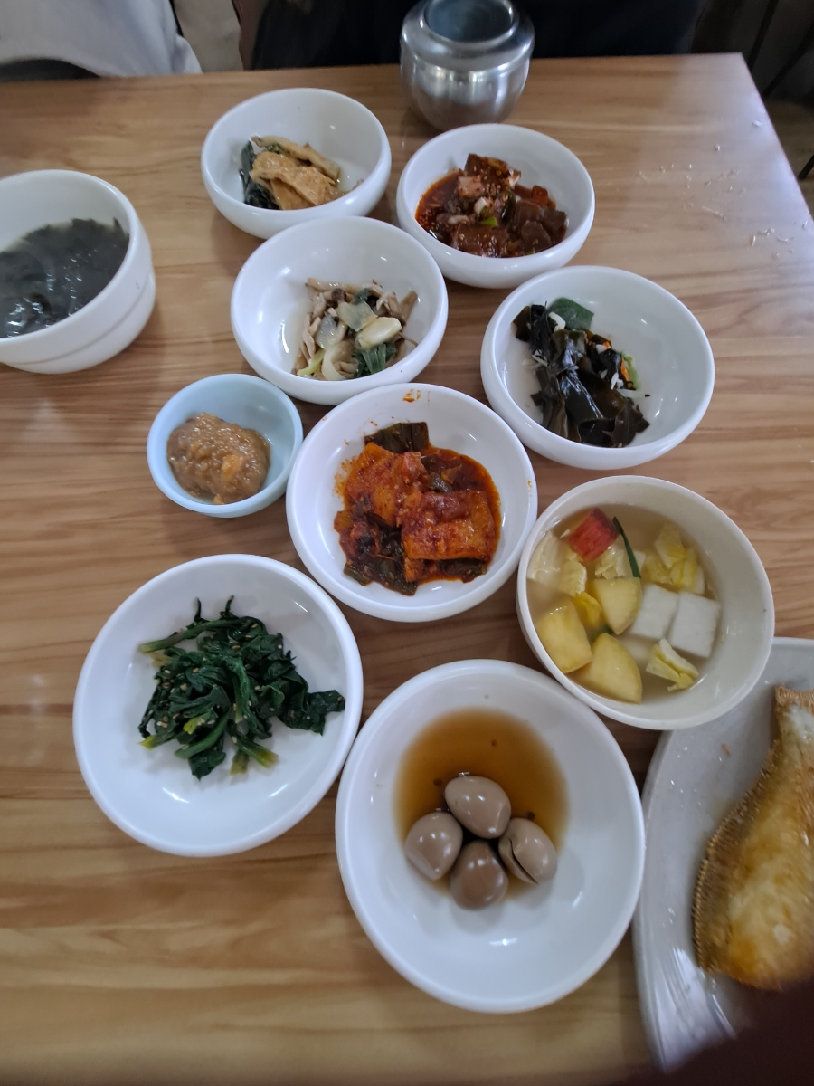 Korean banchan variety small side dishes in white bowls