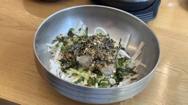 Mulhoe with the icy broth poured in at Hwanyeo Hoetjip
