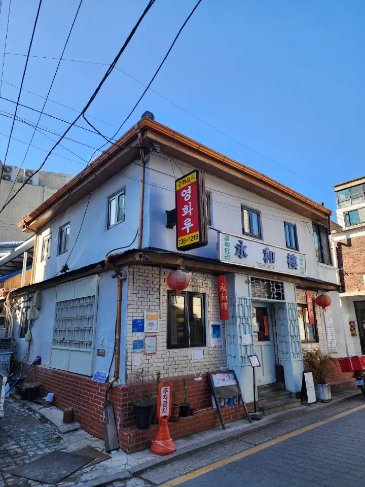 Exterior of Yeonghwaru on a Seochon street corner with red lanterns