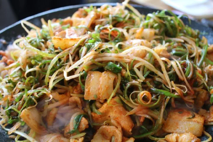 Close-up of Yong-ee Sikdang duruchigi with pork and vegetables mixed together