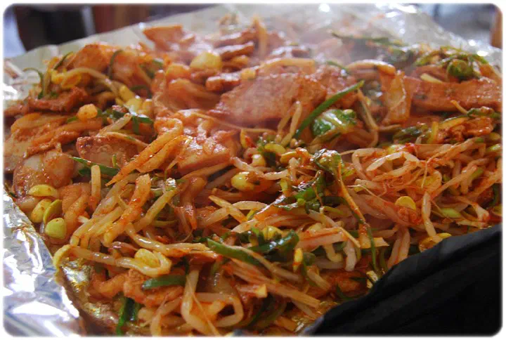 Jeju-style duruchigi stir-fried with bean sprouts and vegetables on the grill