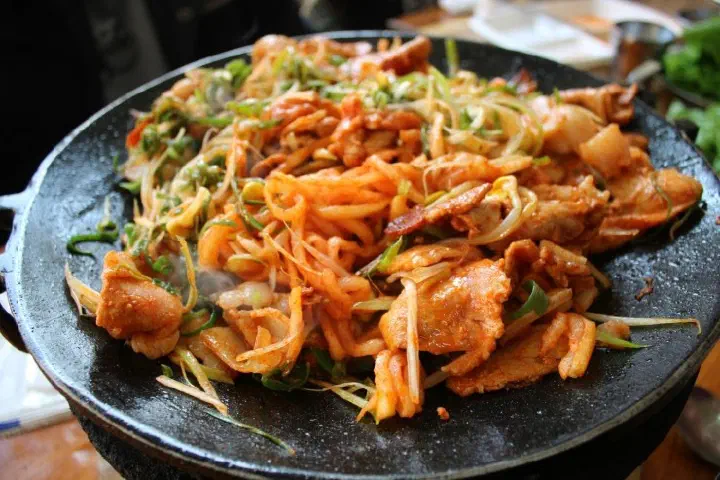 Yong-ee Sikdang duruchigi piled high with stir-fried vegetables and pork