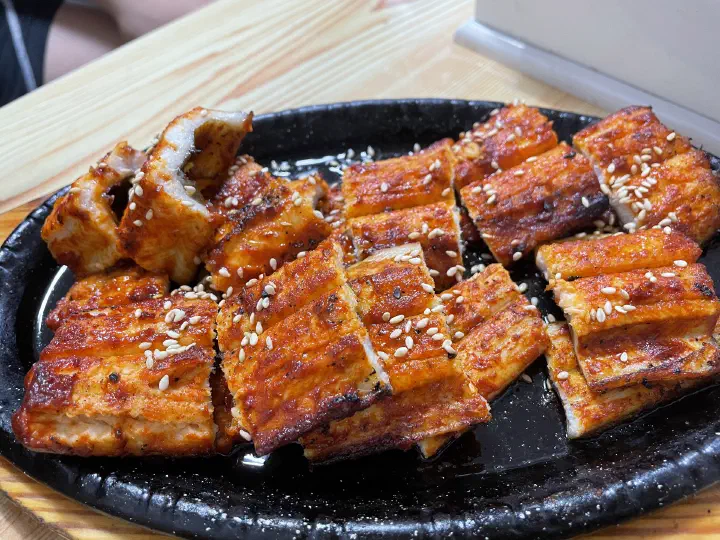Close-up of sutbul bada jangeo gui, charcoal-grilled conger eel glazed with chili marinade