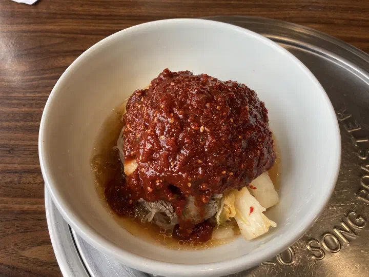 Woo Lae Oak bibim naengmyeon, buckwheat noodles topped with a spicy red chili sauce