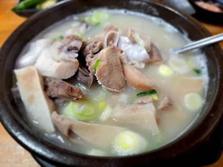 Close-up of pork offal in the soup: pig stomach, ampong, liver and lung