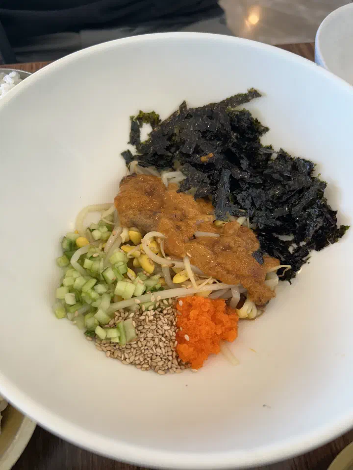 Sea urchin bibimbap at Chungchosoo Mulhoe Sokcho, sea urchin roe with seaweed, bean sprouts and flying fish roe