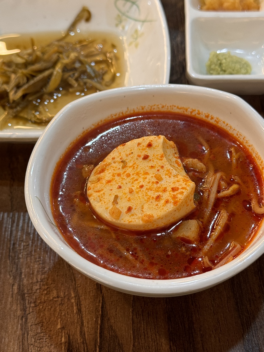 Spicy sundubu jjigae soft tofu stew with sprouts