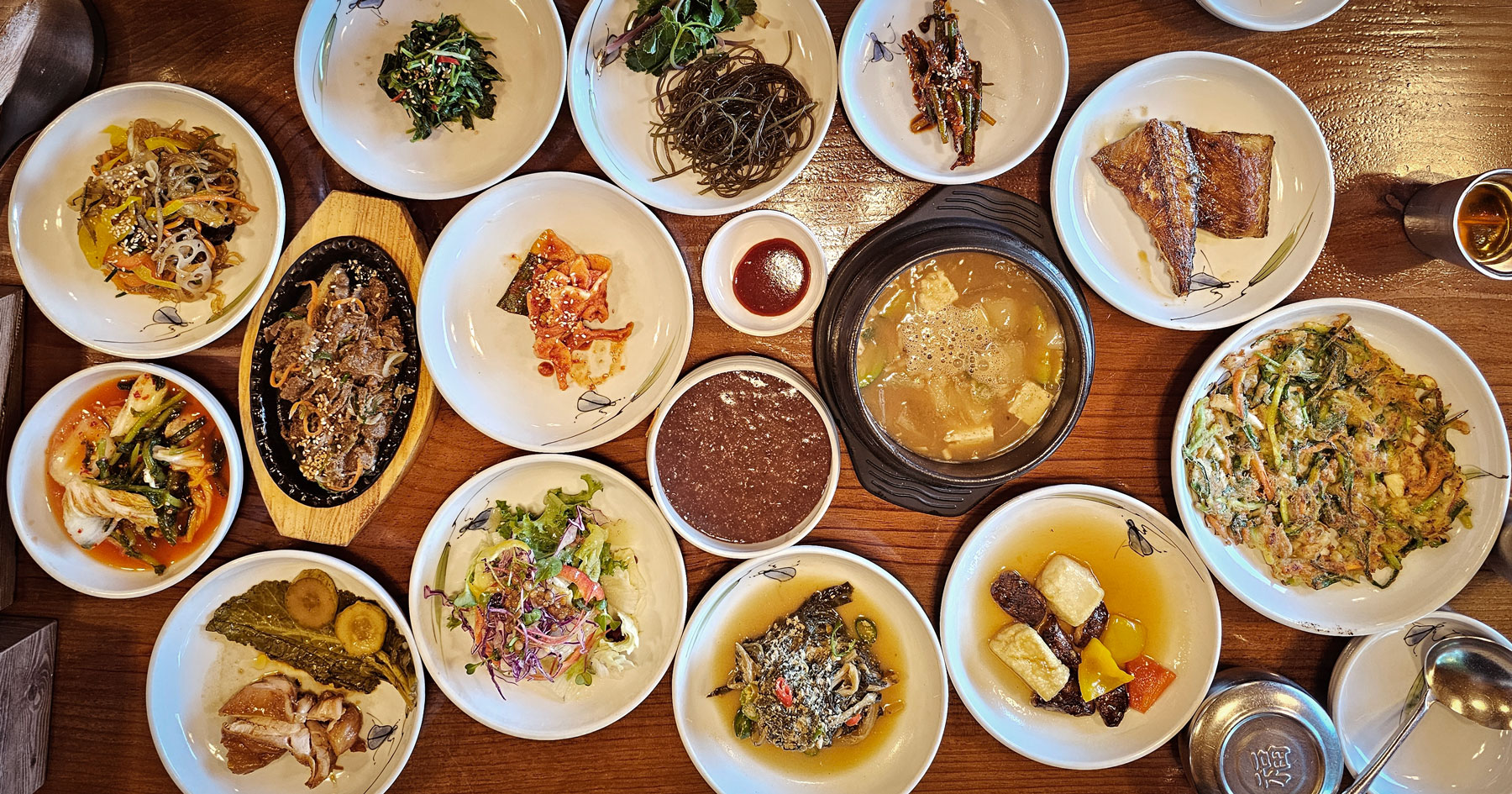 A full spread of Korean side dishes at Yullijeong