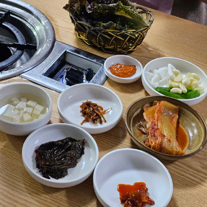 Banchan side dishes at Downmok Salgui Restaurant