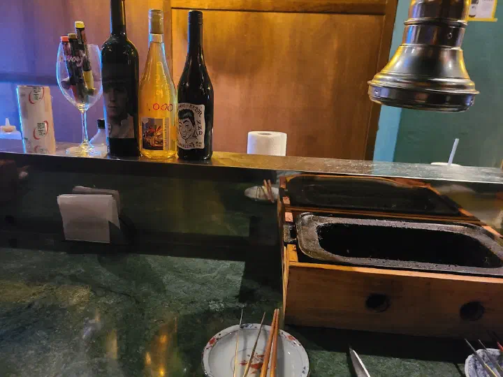 Counter seating at Eunsincheo with an individual charcoal brazier at each table