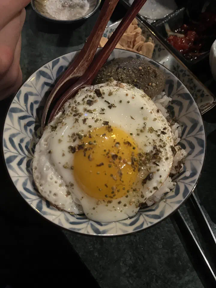 Rice bowl topped with a soft-cooked egg at Eunsincheo