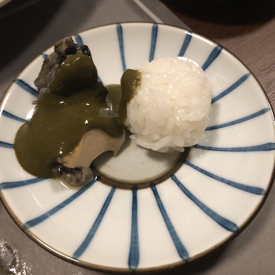 Steamed abalone with sea innard sauce over rice