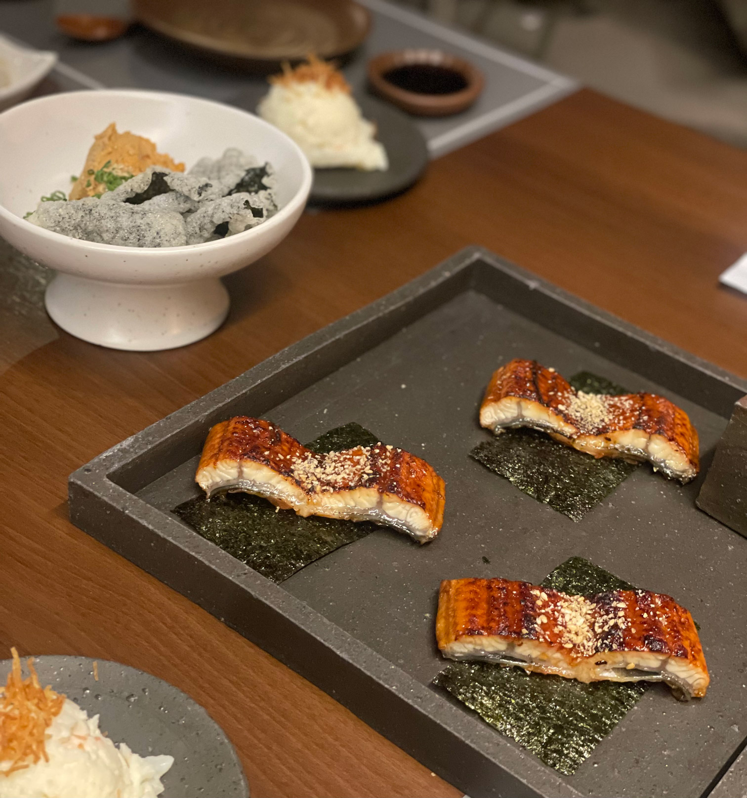 Grilled eel with monkfish liver and seaweed crisps