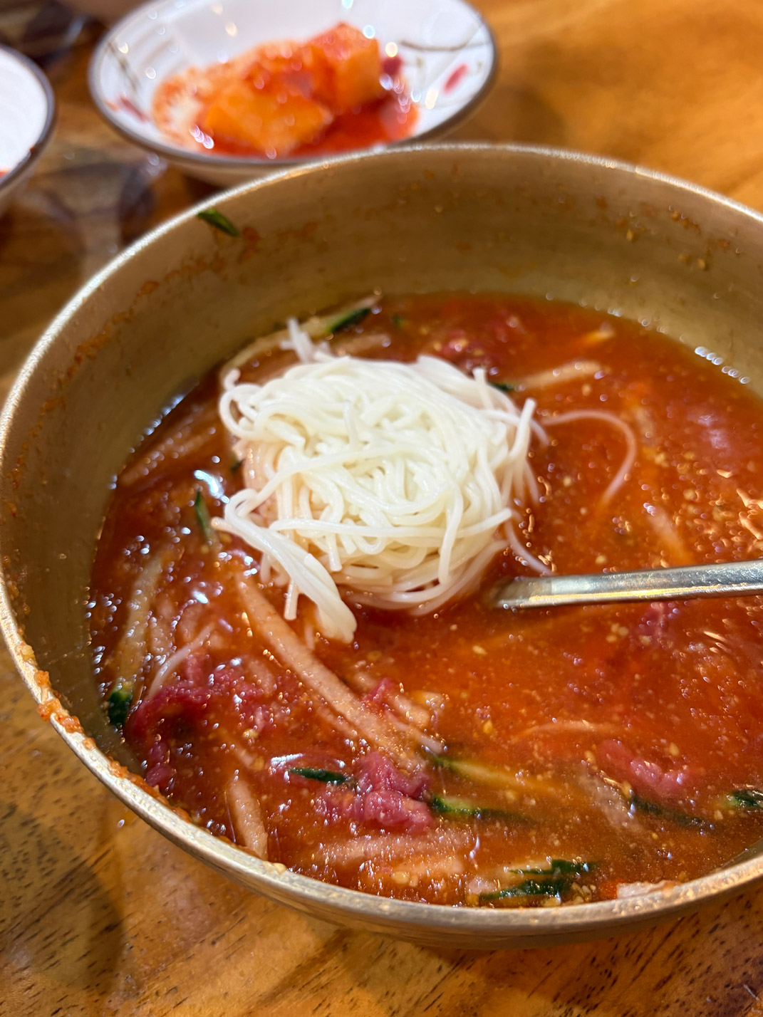Hamyangjip hanu mulhoe served with somyeon noodles