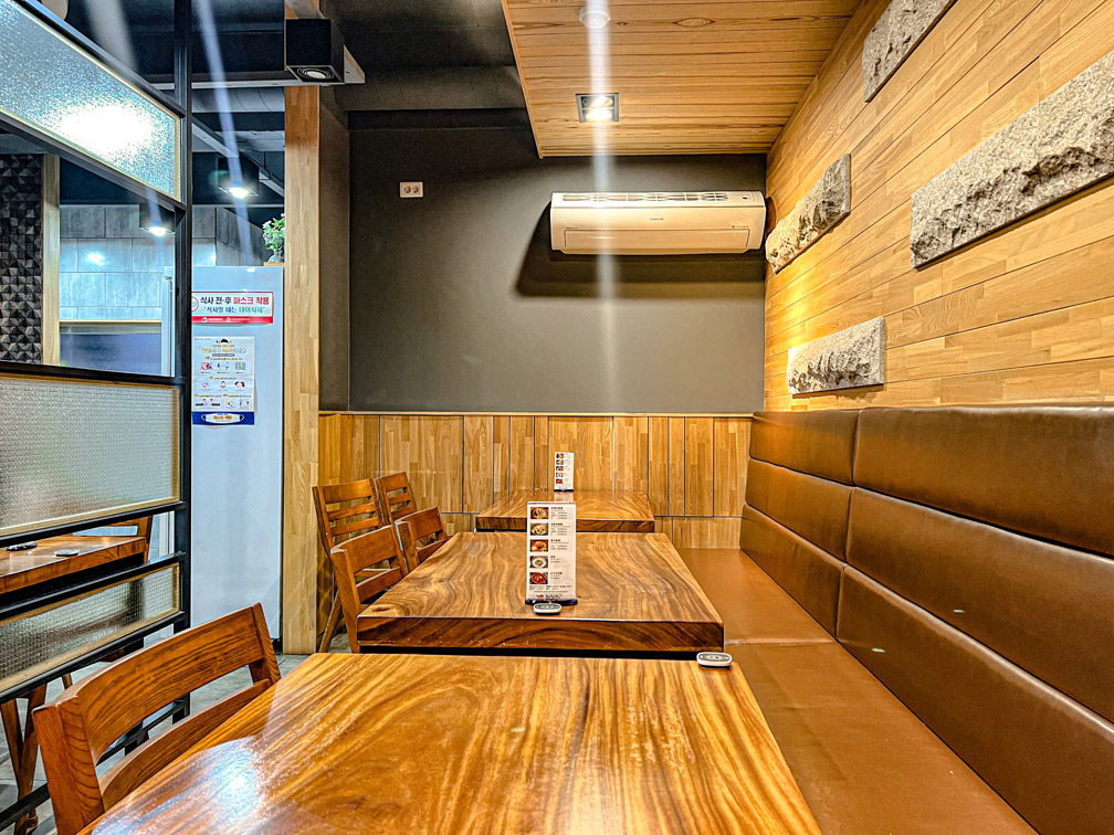Wood-paneled seating area inside Hamyangjip