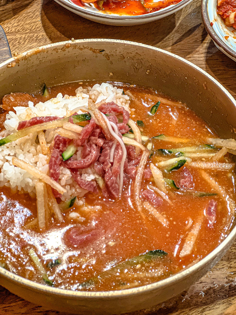 Hamyangjip mulhoe with rice stirred in