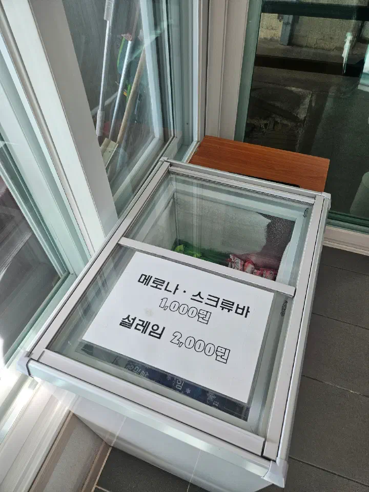 Freezer with Korean ice pops Melona and Screw Bar at the entrance