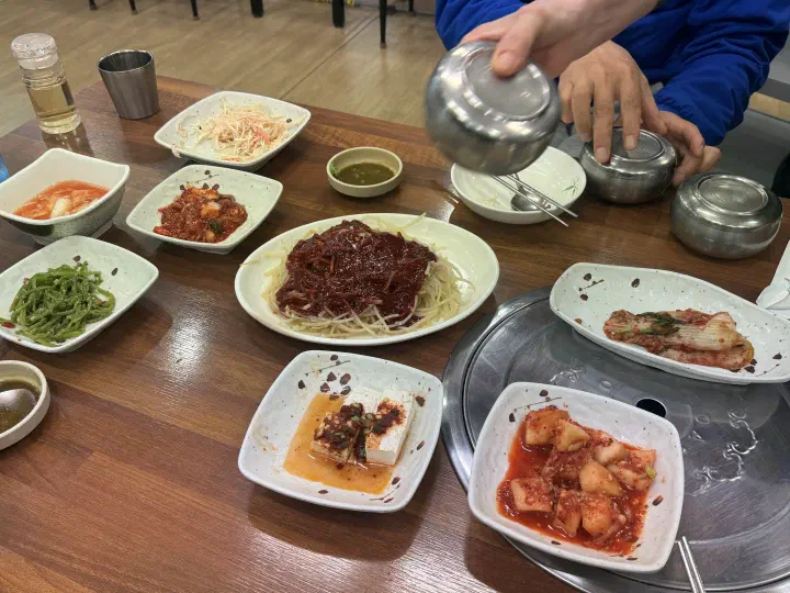 Banchan spread at Jinhwa Bokguk