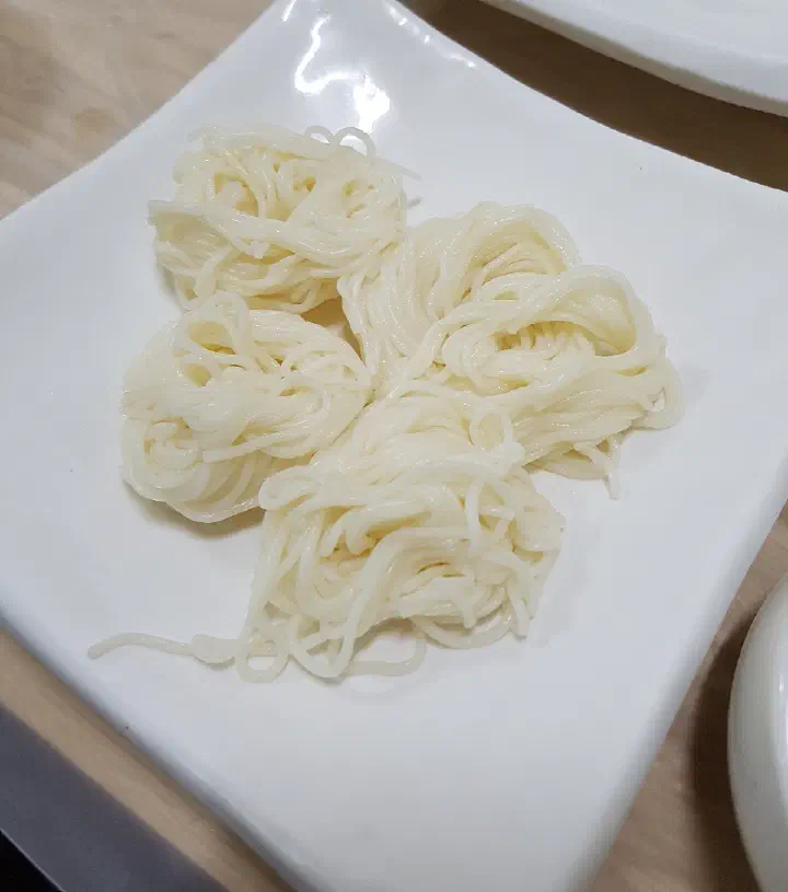 Somyeon noodles served with yukil mulhoe