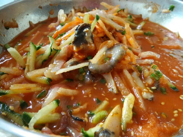 Fresh sliced fish and vegetables in yukil mulhoe