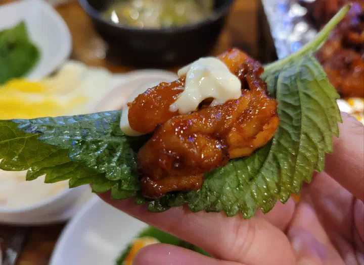 Grilled chicken wrapped in cabbage leaf at Saengsaeng-gui Saengsaeng