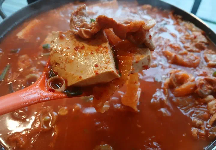 Close-up of tofu in the kimchi stew at Saengsaeng-gui Saengsaeng