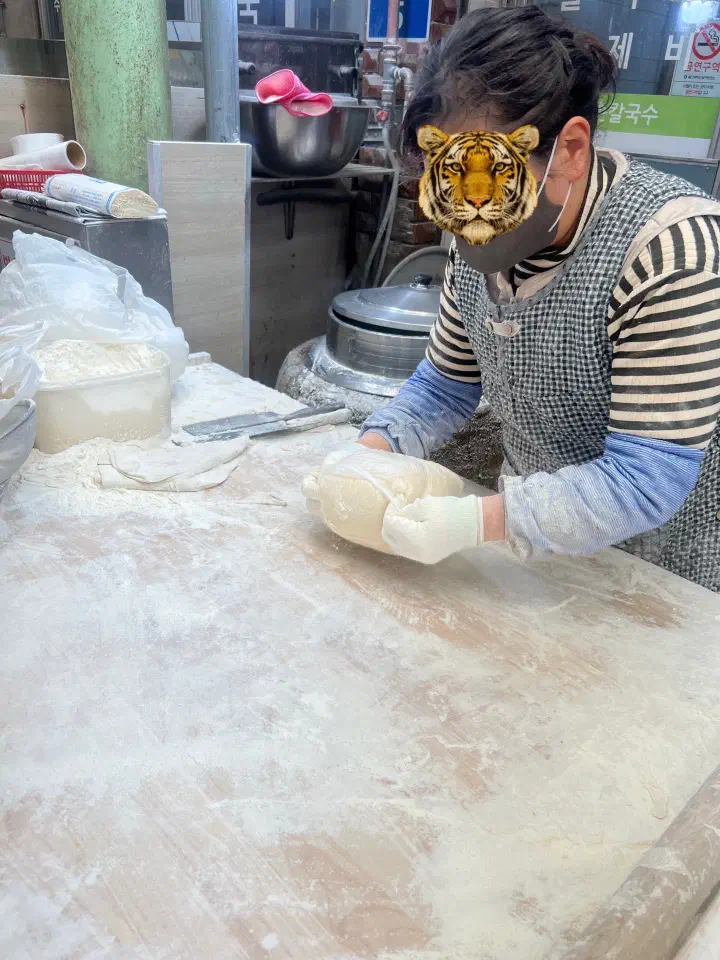 Rolling out the dough by hand at Gyeongju Sonkalguksu