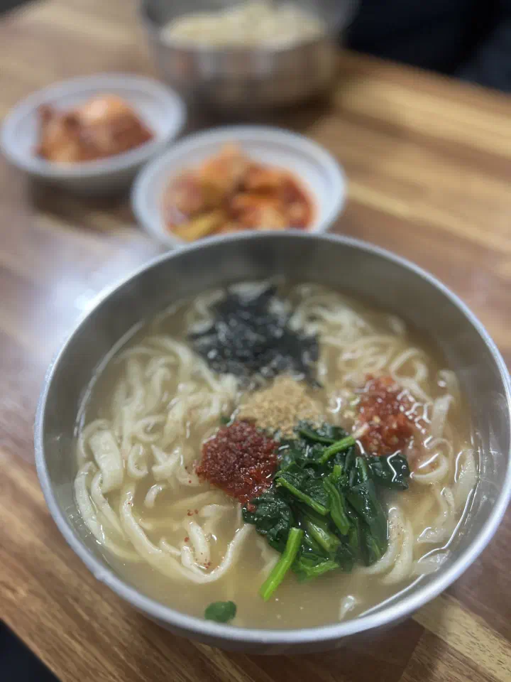 A bowl of sonkalguksu in rich anchovy broth at Gyeongju Sonkalguksu