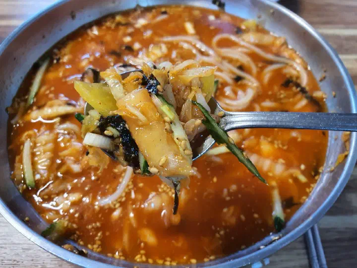 Close-up of cold kimchi kalguksu