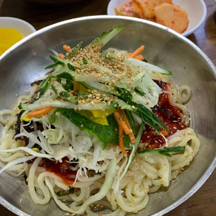 Spicy bibim kalguksu with red sauce at Somunnan Kalguksu
