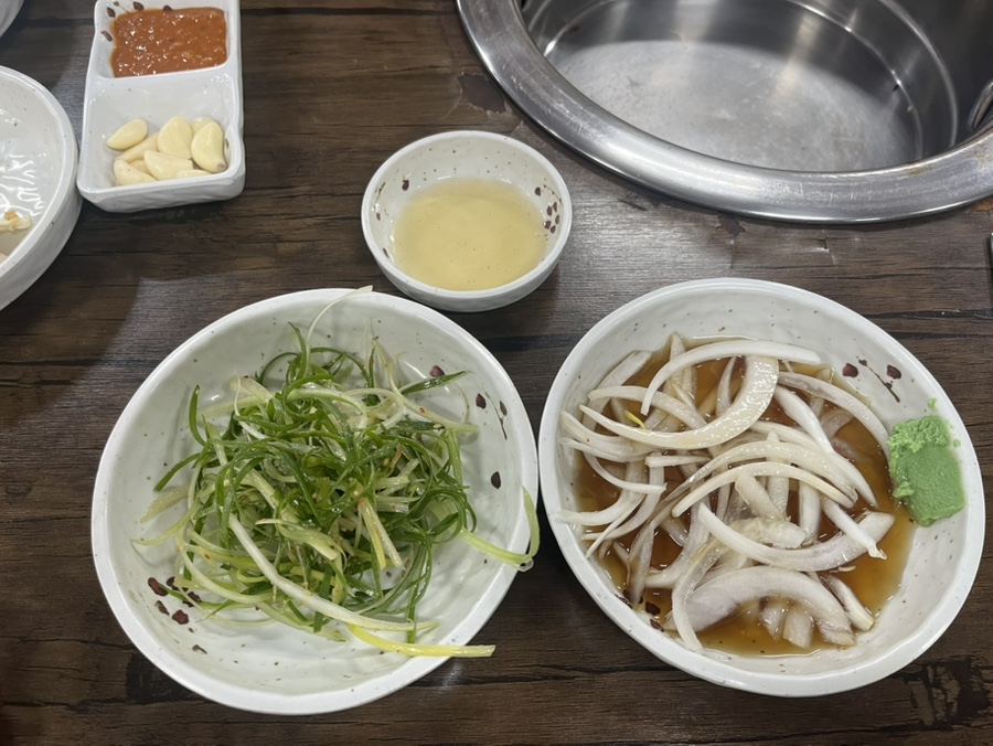 Scallion salad and pickled onions with soy dressing