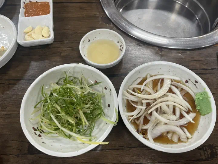Scallion salad and pickled onions with soy dressing