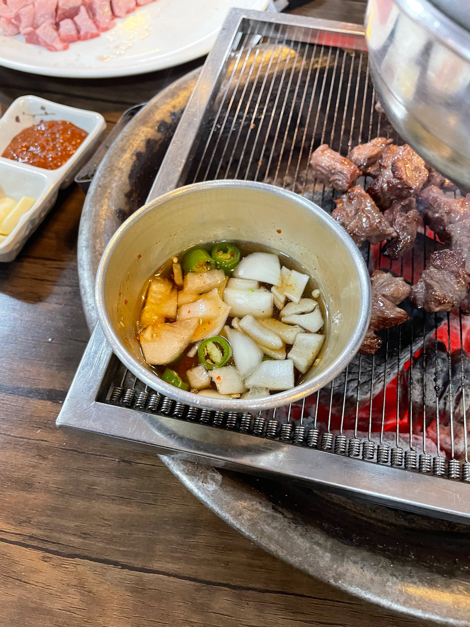 Onion and jeotgal sauce on the grill