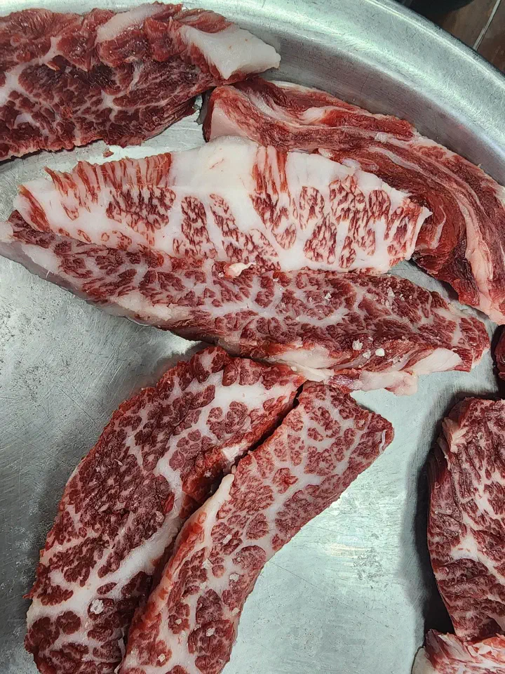 Close-up of Hanwoo galbisal marbling, premium Korean beef short rib