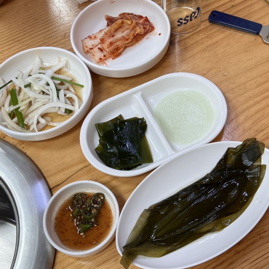 Kimchi, pickled onion, kelp and other Korean side dishes