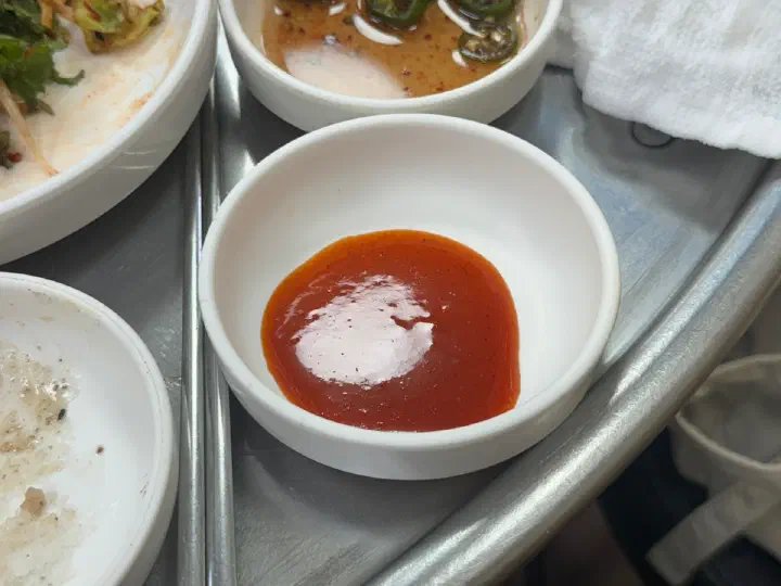 Small dish of dipping sauce served with marinated galbisal