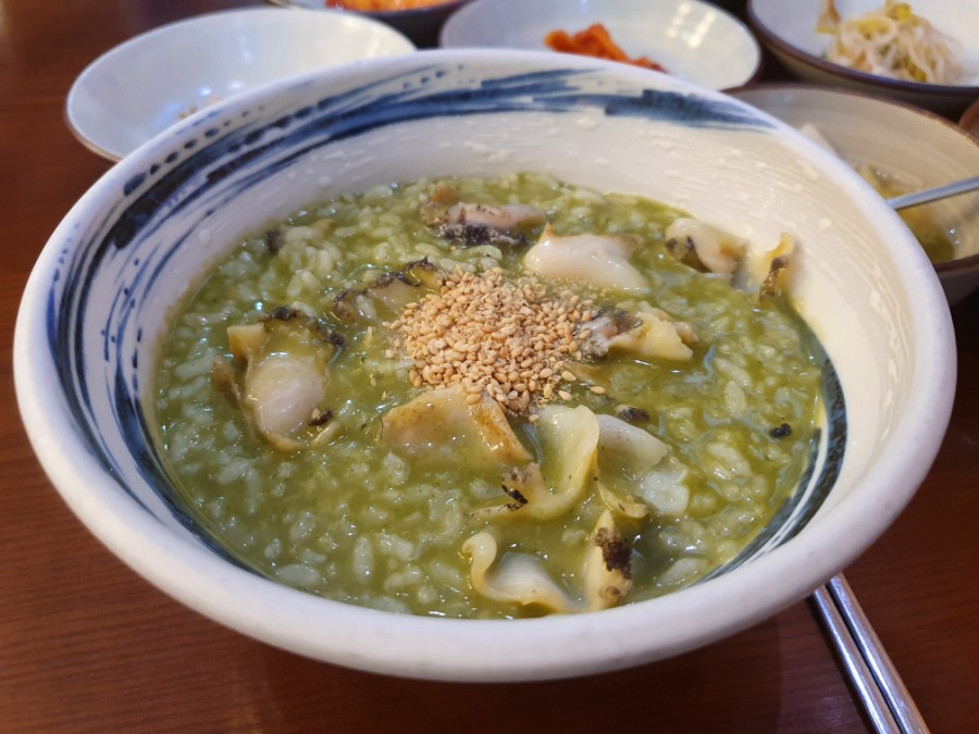Abalone slice toppings on porridge at Wonjo Jeonbokjuk