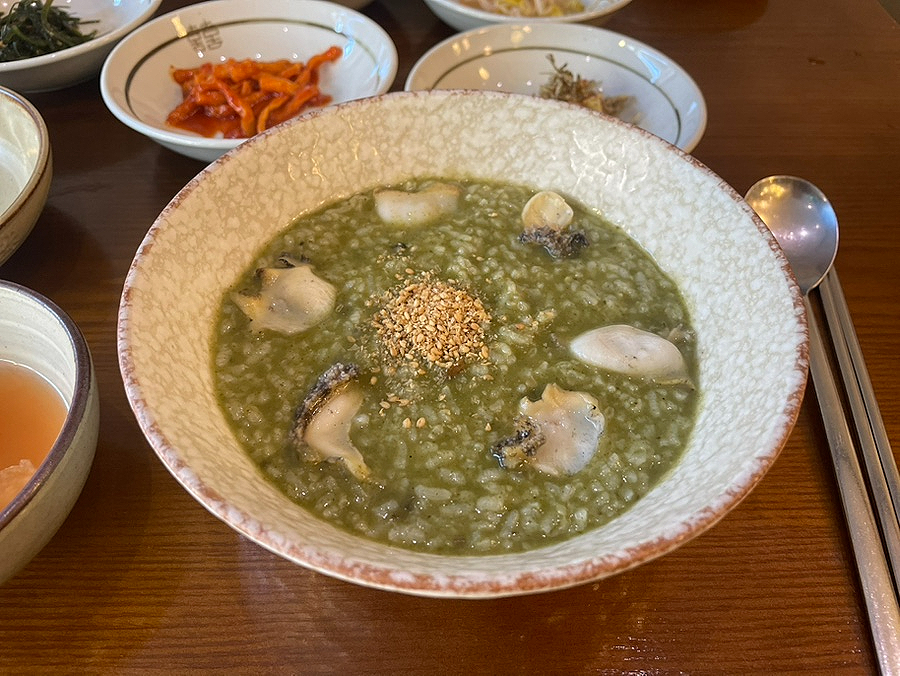 Close-up of green abalone broth at Wonjo Jeonbokjuk
