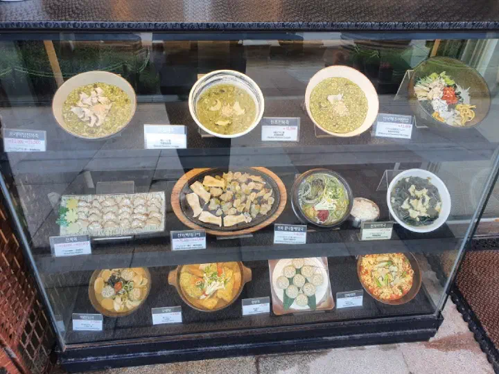 Wonjo Jeonbokjuk display case with dish models and prices