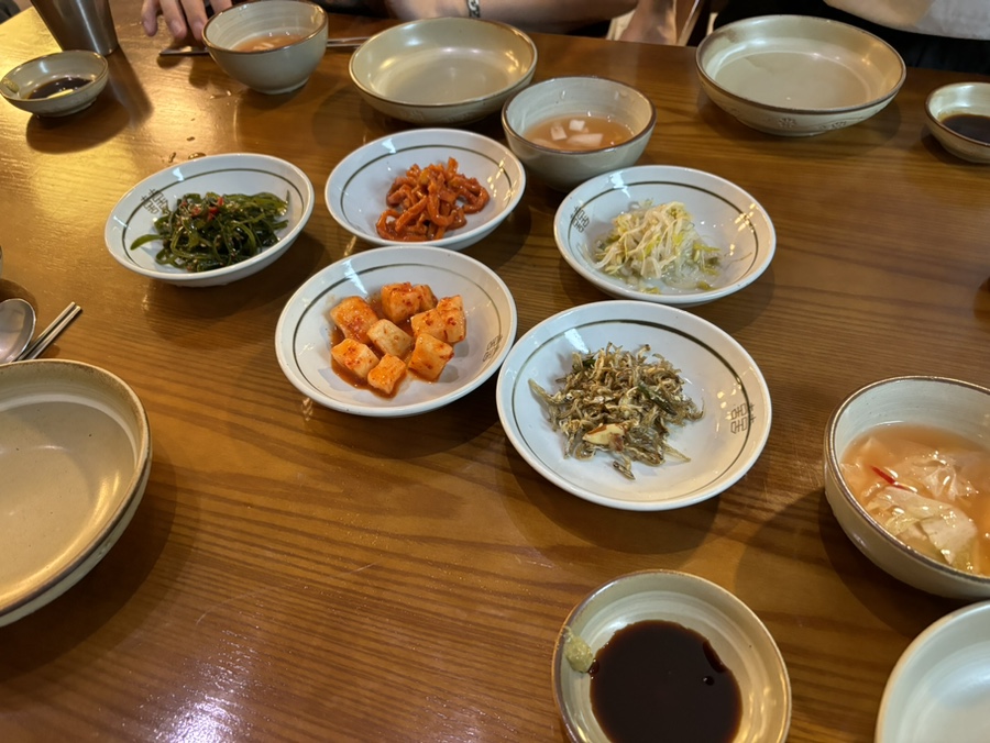 Banchan spread at the table at Wonjo Jeonbokjuk