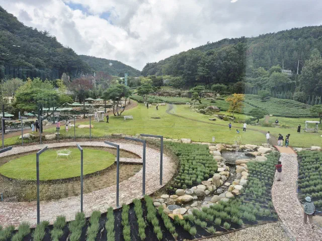 Lawn, stream and walking paths in the registered private garden at Neutinamu-ui Sarang Cafe