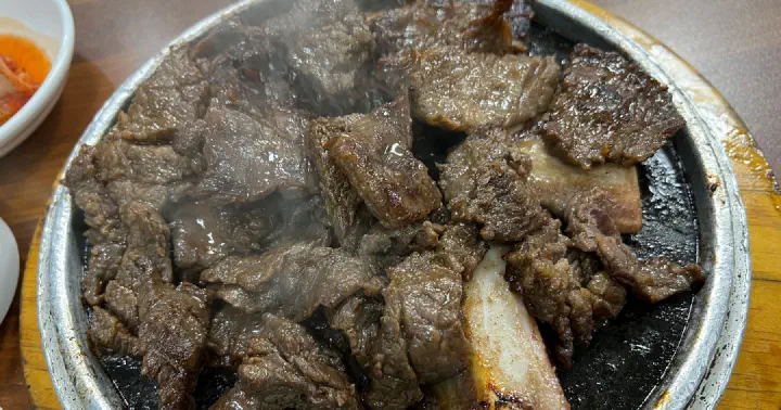 Steaming Korean beef ribs close-up at Sobok Galbi