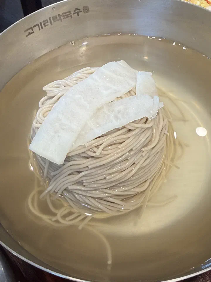 Mul makguksu, buckwheat noodles in clear mild cold broth, at Gogiri Makguksu