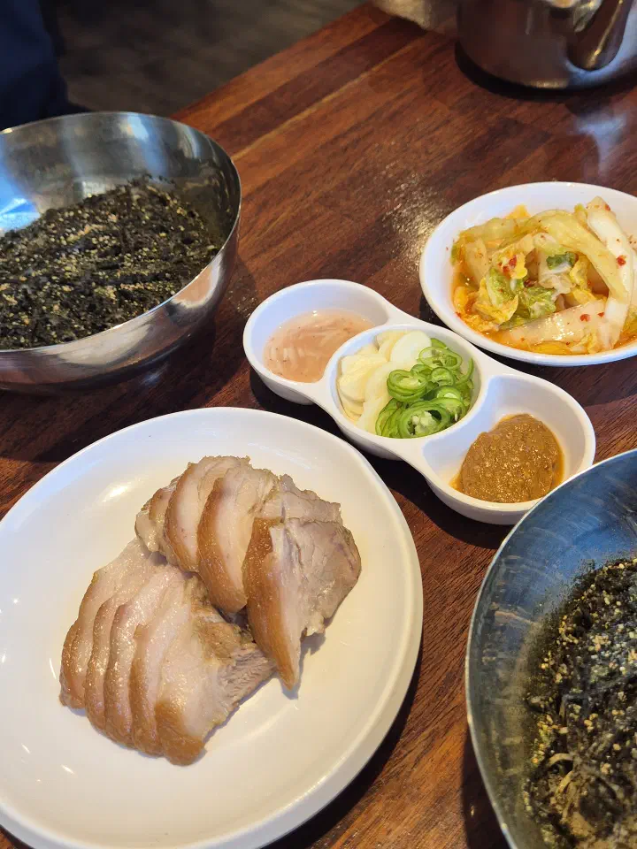 House kimchi served with suyuk, salted shrimp and ssamjang at Gogiri Makguksu